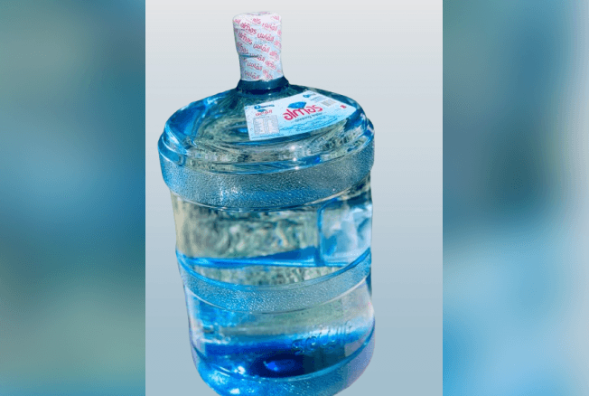 Almas drinking-water bottle accompanying an educational alkaline-water guide